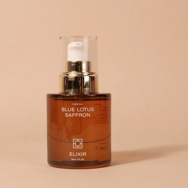 Ayurvediskt face elixir med blå lotus och saffran i glasflaska
